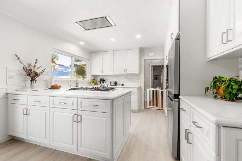 After view of bright white kitchen cabinet refresh
