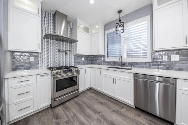 After view of bright white small kitchen