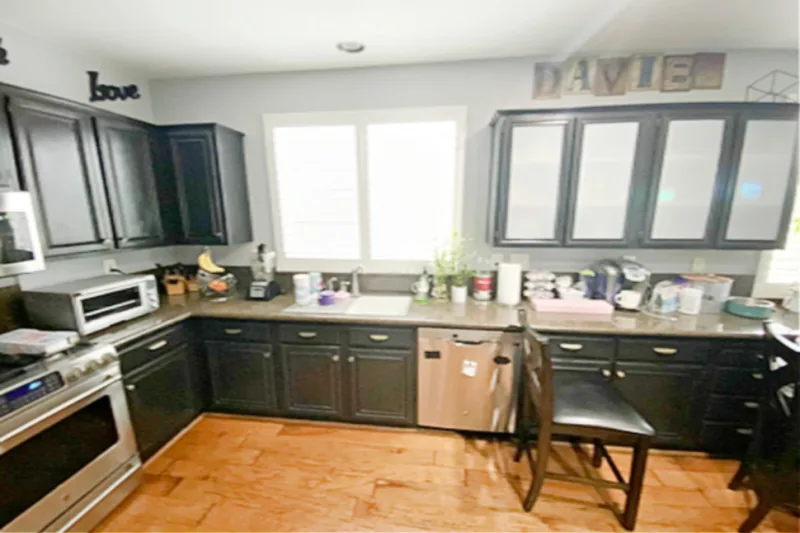Before view of bright white small kitchen