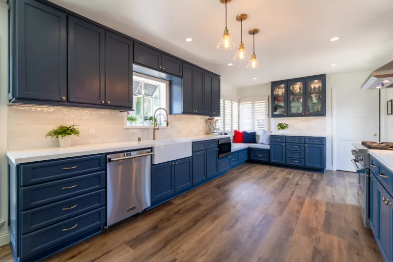 After view of deep blue kitchen cabinets