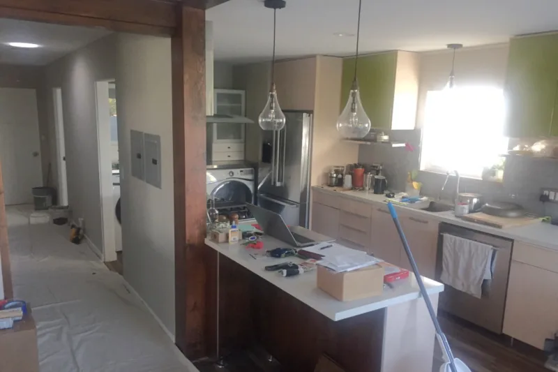 Before view of gray cabinets with rustic wood accents