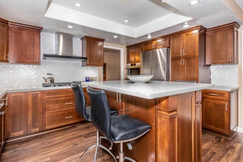 After view of warm wood shaker kitchen