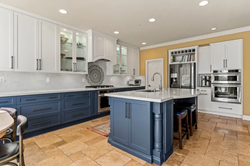 After view of white and blue two-tone cabinets