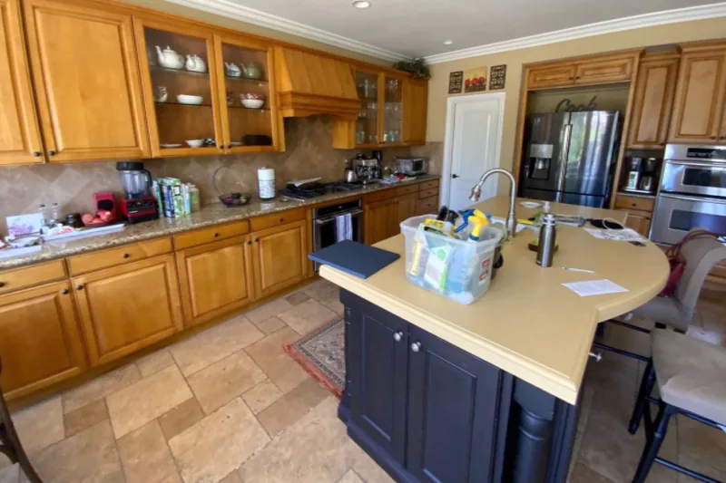 Before view of white and blue two-tone cabinets