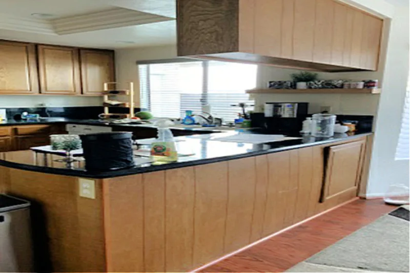 Before view of white kitchen with blue island