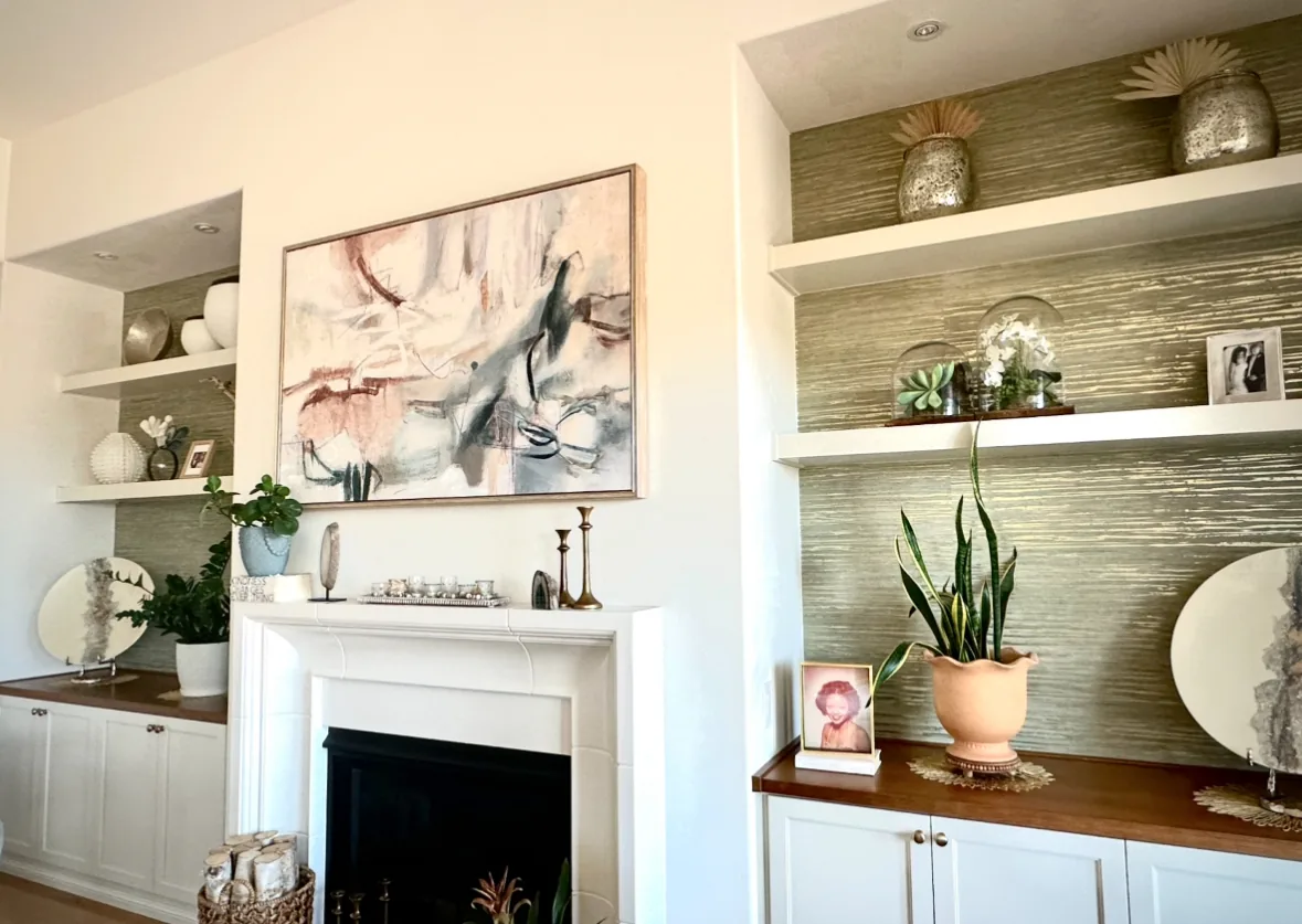 Refinished built-in cabinetry beside fireplace