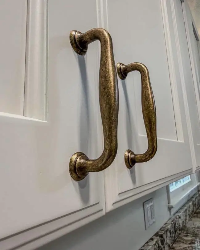 Antique brass cabinet pull detail