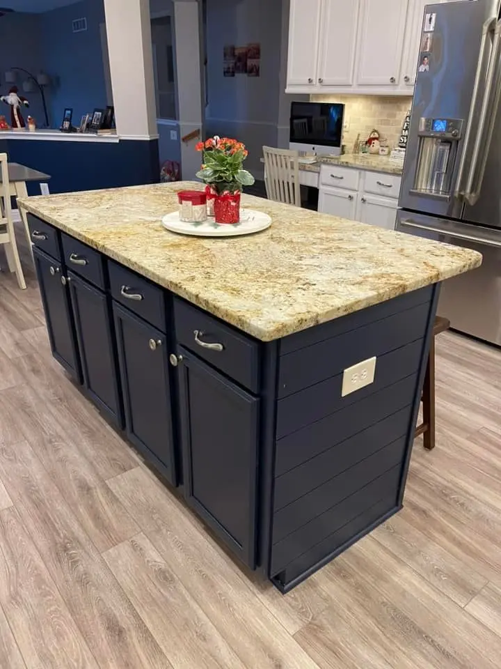 Navy kitchen island with a smooth finish and clean hardware alignment