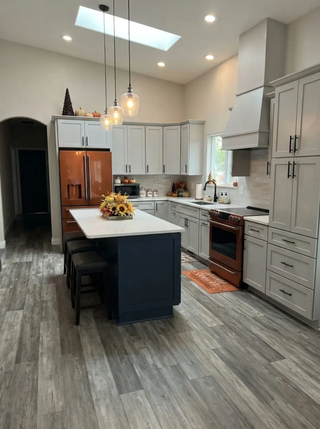 White kitchen cabinets with black island